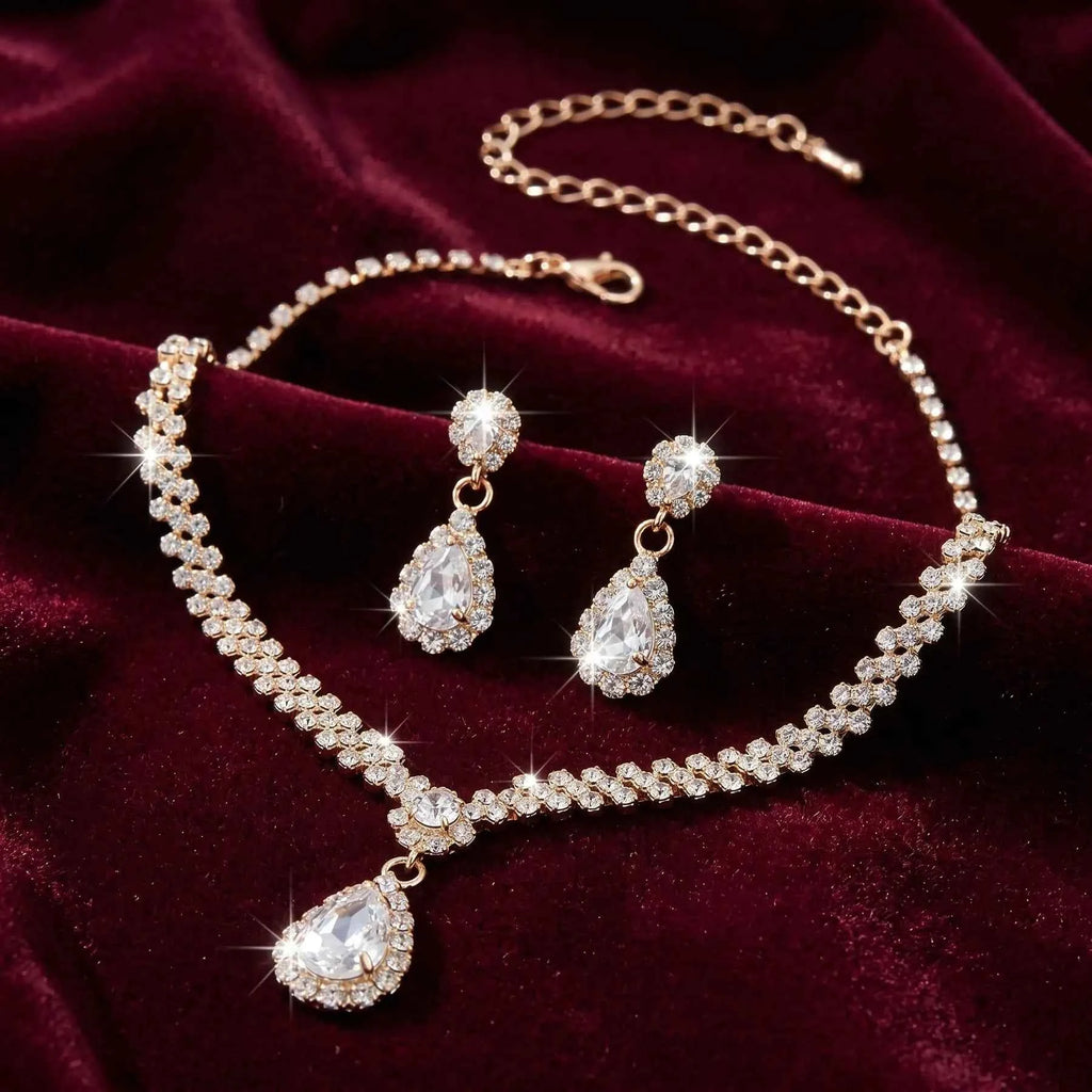 Jewelry set with necklace and earrings on a burgundy velvet background