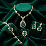 Emerald Teardrop Halo Jewellery Set